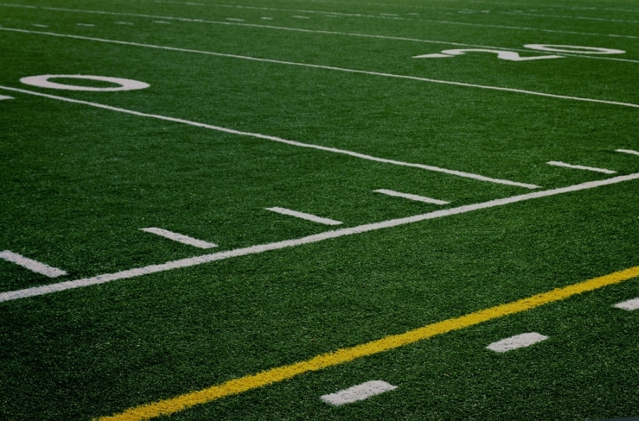 Side picture of football field turf with lines
