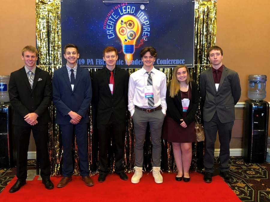 6 Students in front of the FBLA State leadership conference banner 
