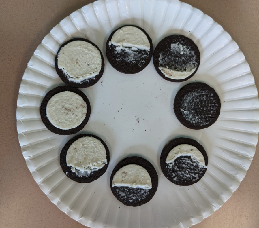 Oreos in the shape of the moon phases.