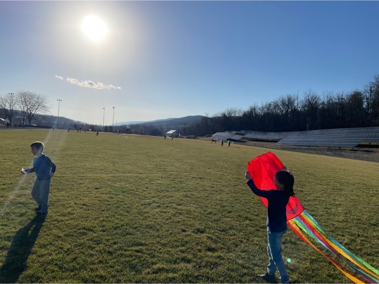 students flying kites