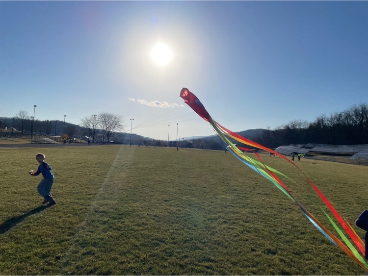 students flying kites